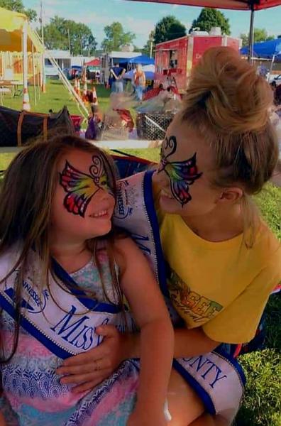 Two former Miss Cannon County Fair Pageant winners Willow Gnida and Monica Carlton get face painted up