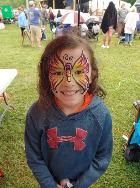  Alaiyh Duncan gets her face painted at the fair.